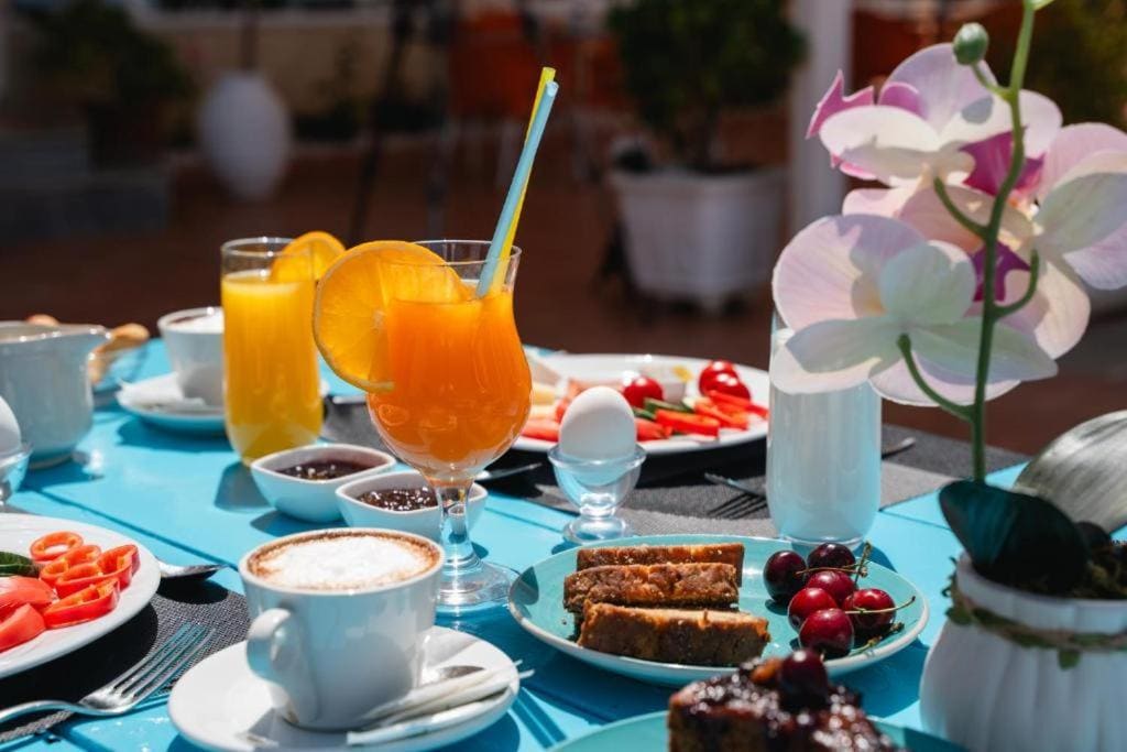A breakfast table, with coffee and juice