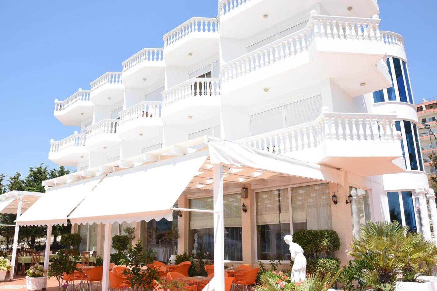 The terrace, under its white awnings