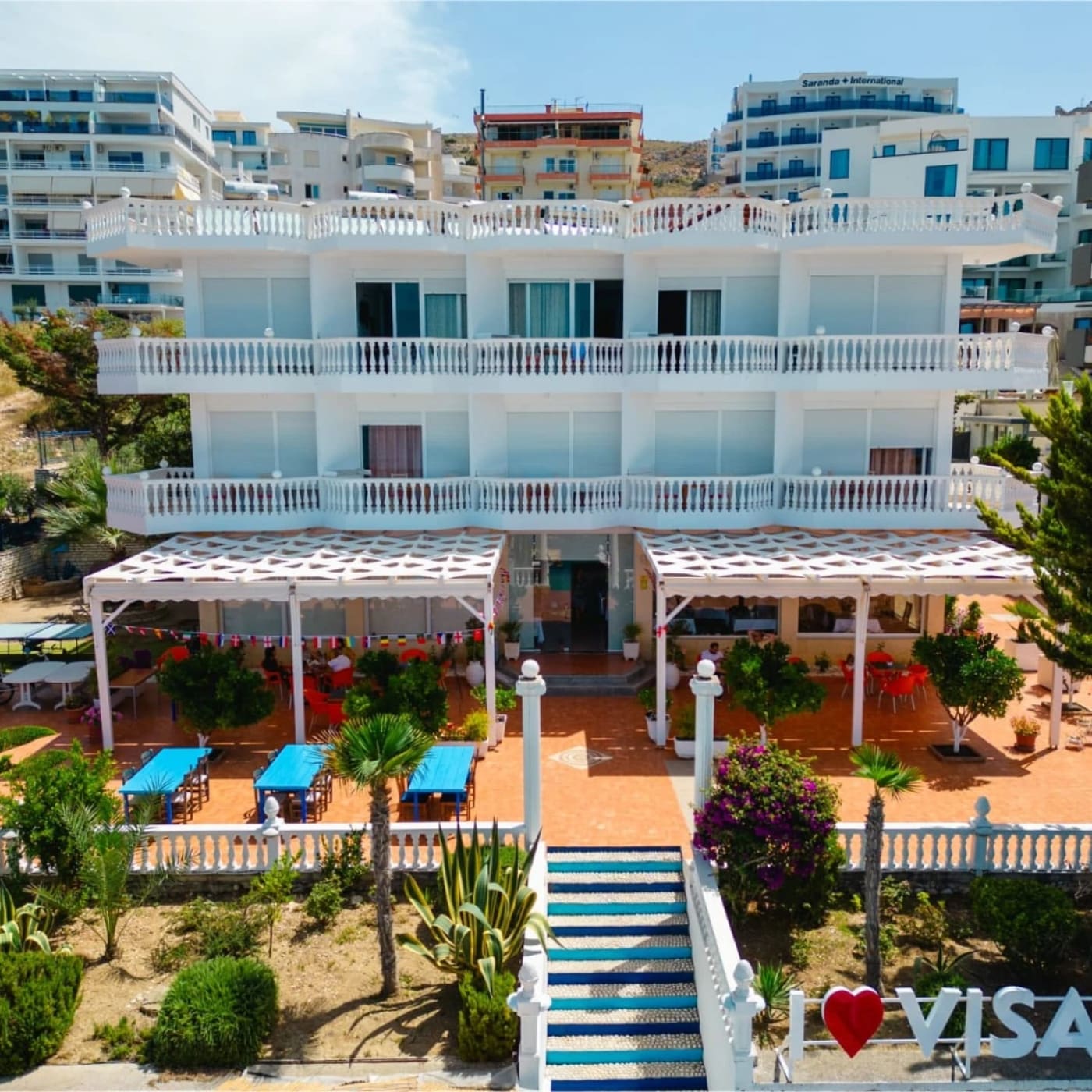 The hotel, its garden and the steps to the beach